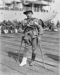 A soldier with an injured leg, using crutches, prior to boarding either SS Makarini or HMAT Star of Victoria (A16) - Port Melbourne, 10 September, 1915. Reprinted courtesy of the Australian War Memorial