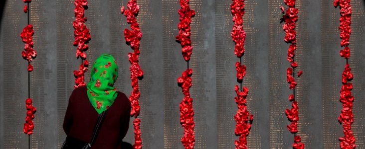 People visit the roll of honour after the National ANZAC Day ceremony at the Australian War Memorial in Canberra, Thursday, April 25, 2013. Australia is commemorating the 98th anniversary of the landing at Gallipoli during WW1.